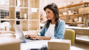 Digital Marketing in Red Deer business owner holding laptop